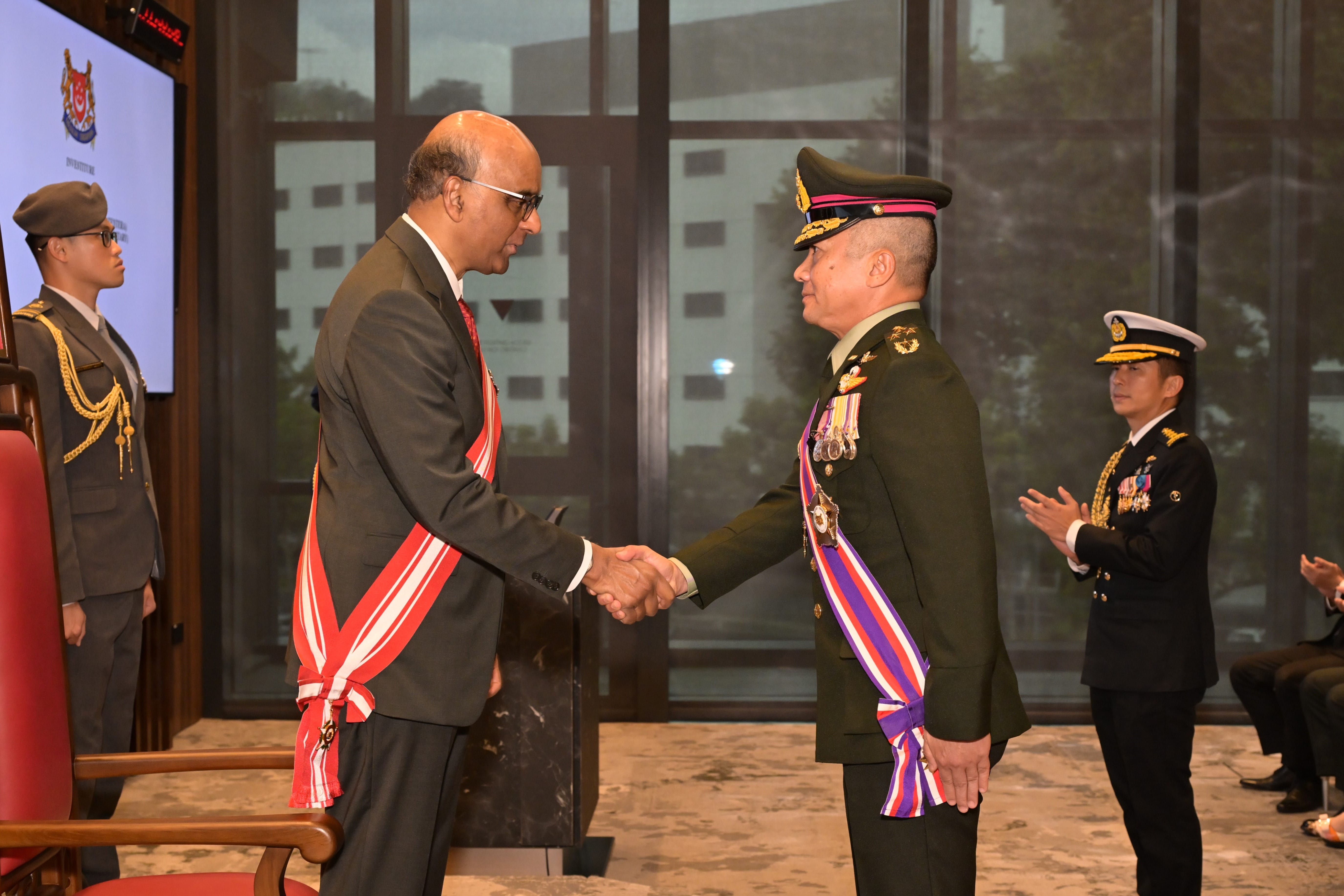 The Chief of Defence Forces (CDF) of the Royal Thai Armed Forces (RTARF) General (GEN) Songwit Noonpackdee (right) 